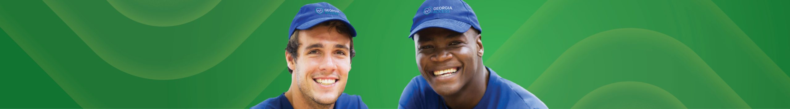 Two men smiling.