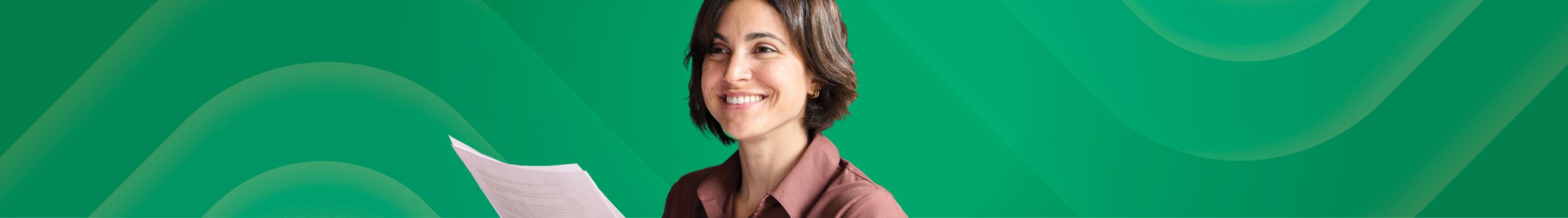 Woman smiling and holding documents.